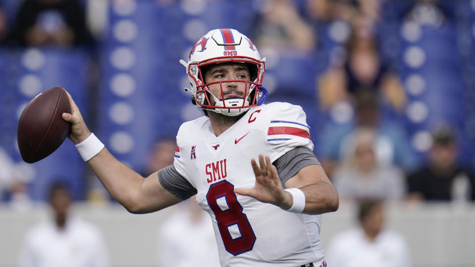 FILE - SMU quarterback Tanner Mordecai throws a pass against Navy during the first half of an NCAA college football game, Saturday, Oct. 9, 2021, in Annapolis, Md. Mordecai has already set a single-season SMU record with 37 touchdown passes after finally getting his opportunity to be a starting quarterback, which is no surprise to his former teammate at Oklahoma that he recruited to join him on the Hilltop. (AP Photo/Julio Cortez, File)