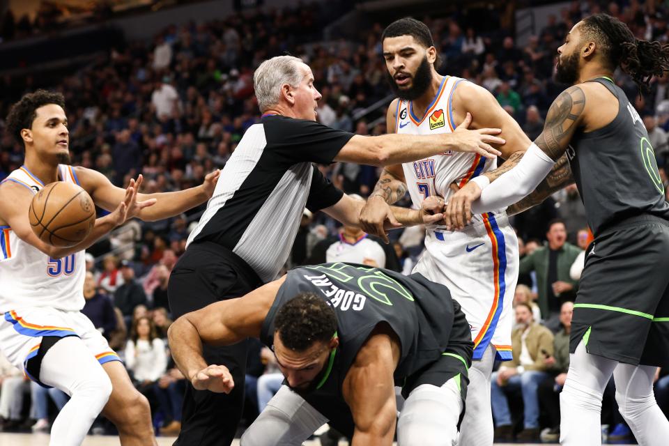 Dec 3, 2022; Minneapolis, Minnesota, USA; Oklahoma City Thunder forward Kenrich Williams (34) and Minnesota Timberwolves center Rudy Gobert (27) get into a scrum during the second quarter at Target Center. Gobert was ejected after receiving a fragrant two foul. Mandatory Credit: Matt Krohn-USA TODAY Sports