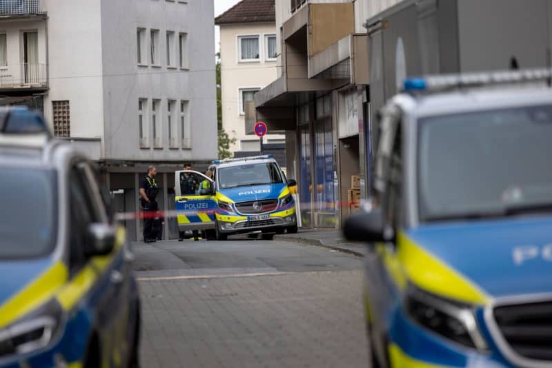 Police vehicles cordon off city center early morning after knife attack at Solingen city festival. Several people were killed and injured Friday night in a knife attack at the city festival celebrating the 650th anniversary of the city of Solingen. Thomas Banneyer/dpa