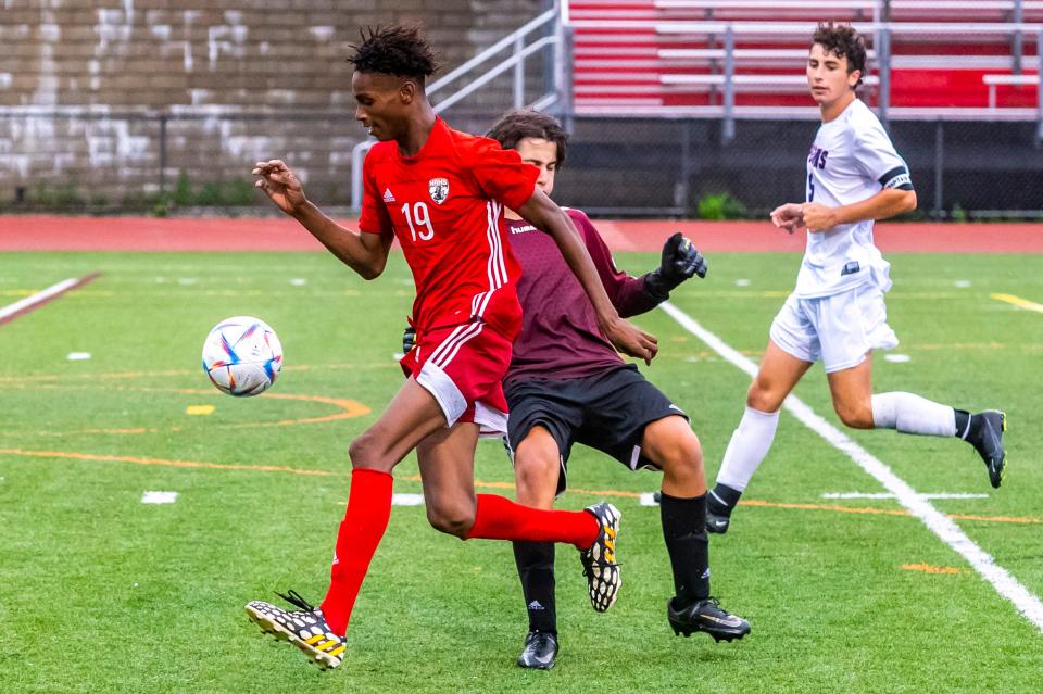 New Bedford's Nicolas Rosa drives by Bridgewater-Raynhams's goalie Connor Nichols.  Rosa was called offsides on the play.