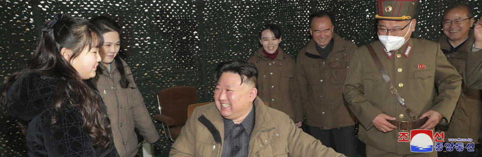 This photo provided April 14, 2023, by the North Korean government, shows North Korean leader Kim Jong Un, center, his daughter, wife, Ri Sol Ju, second left, and his sister Kim Yo Jong, rear center, as they inspect what it says is the test-launch of Hwasong-18 intercontinental ballistic missile Thursday, April 13, 2023 at an undisclosed location, North Korea. Independent journalists were not given access to cover the event depicted in this image distributed by the North Korean government. The content of this image is as provided and cannot be independently verified. Korean language watermark on image as provided by source reads: "KCNA" which is the abbreviation for Korean Central News Agency. (Korean Central News Agency/Korea News Service via AP)