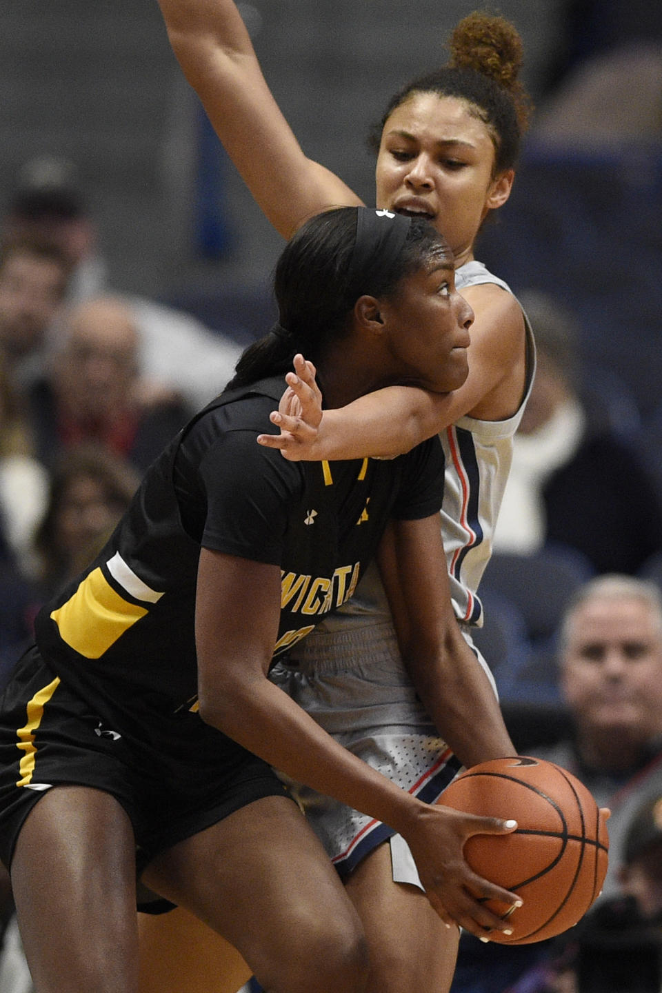 Wichita State's Raven Prince looks to shoot as Connecticut's Olivia Nelson-Ododa, back, defends during the second half of an NCAA college basketball game Thursday, Jan. 2, 2020, in Hartford, Conn. (AP Photo/Jessica Hill)