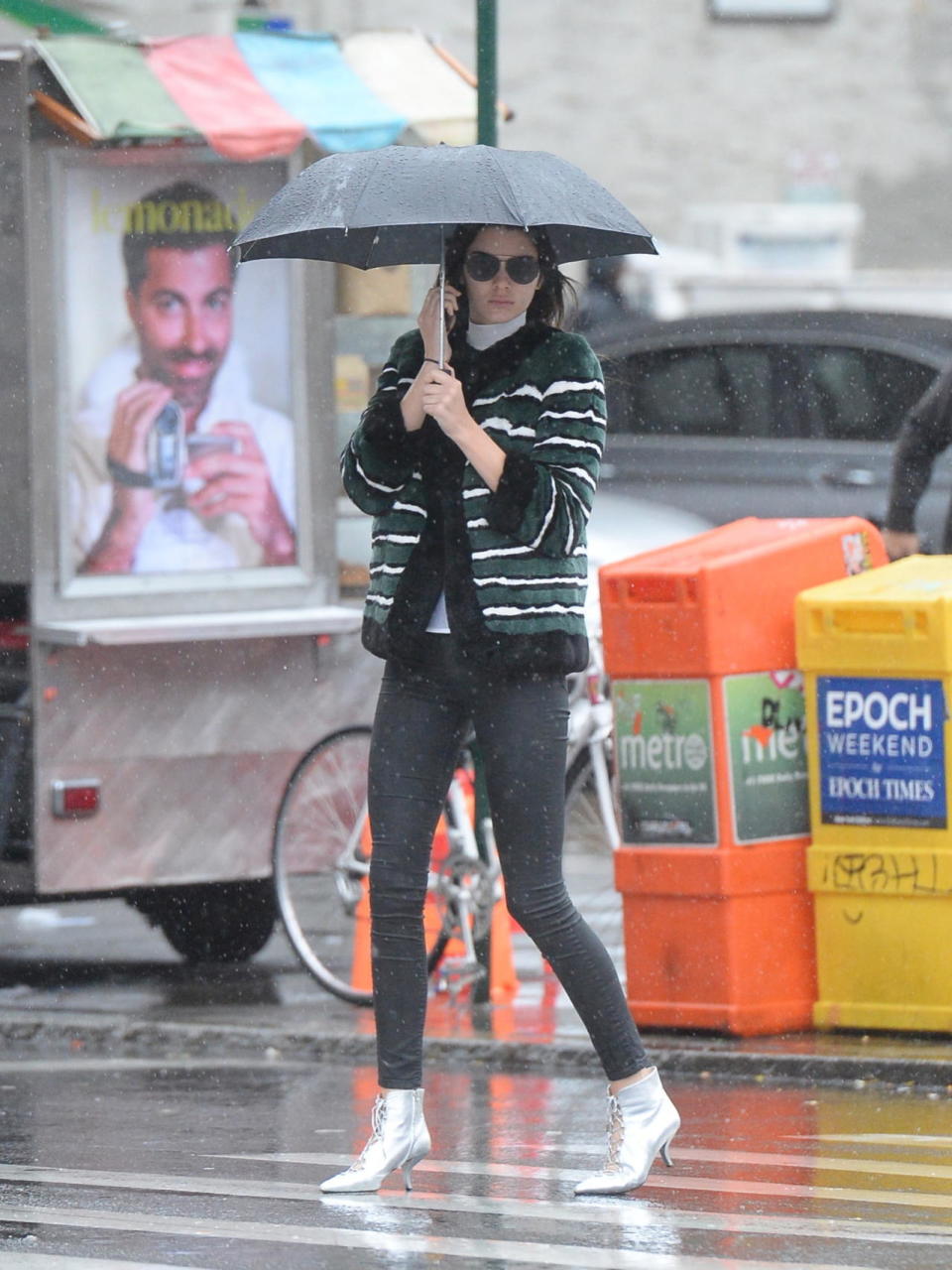 <p>In a green striped, furry coat and metallic lace-up booties, Jenner managed to look cool even in a rainstorm in New York City on her way to The Smile restaurant for lunch. Let’s just hope those kitten heels, which appear to be <a href="http://www.ysl.com/us/shop-product/women/shoes-kitten-heel-cat-boot-50-bootie-in-silver-metallic-leather_cod44628621gh.html" rel="nofollow noopener" target="_blank" data-ylk="slk:Saint Laurent’s sold out “Cat Boot,”;elm:context_link;itc:0;sec:content-canvas" class="link ">Saint Laurent’s sold out “Cat Boot,”</a> are waterproof! (<i>Photo: Splash News)</i></p>