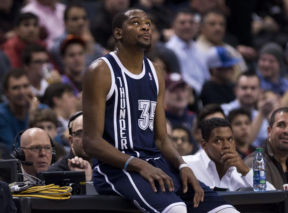 Oklahoma Thunder forward Kevin Durant looks up after being called on a technical foul against the Toronto Raptors during the first half of an NBA basketball game in Toronto on Friday, March 21, 2014. (AP Photo/The Canadian Press, Nathan Denette)