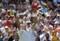 Novak Djokovic of Serbia celebrates after winning his match against Philipp Kohlschreiber of Germany at the Wimbledon Tennis Championships in London, June 29, 2015. REUTERS/Suzanne Plunkett