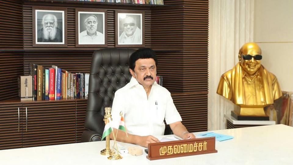 <div class="paragraphs"><p>MK Stalin with photographs of Periyar EV Ramasamy, CN Annadurai and M Karunanidhi in the background.</p></div>