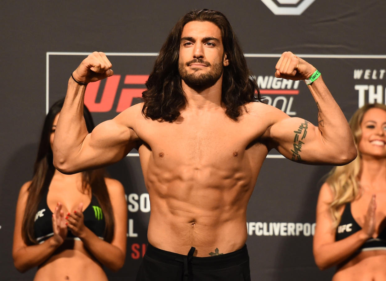 LIVERPOOL, ENGLAND - MAY 26:  Elias Theodorou of Canada poses on the scale during the UFC Weigh-in at ECHO Arena on May 26, 2018 in Liverpool, England. (Photo by Josh Hedges/Zuffa LLC/Zuffa LLC via Getty Images)