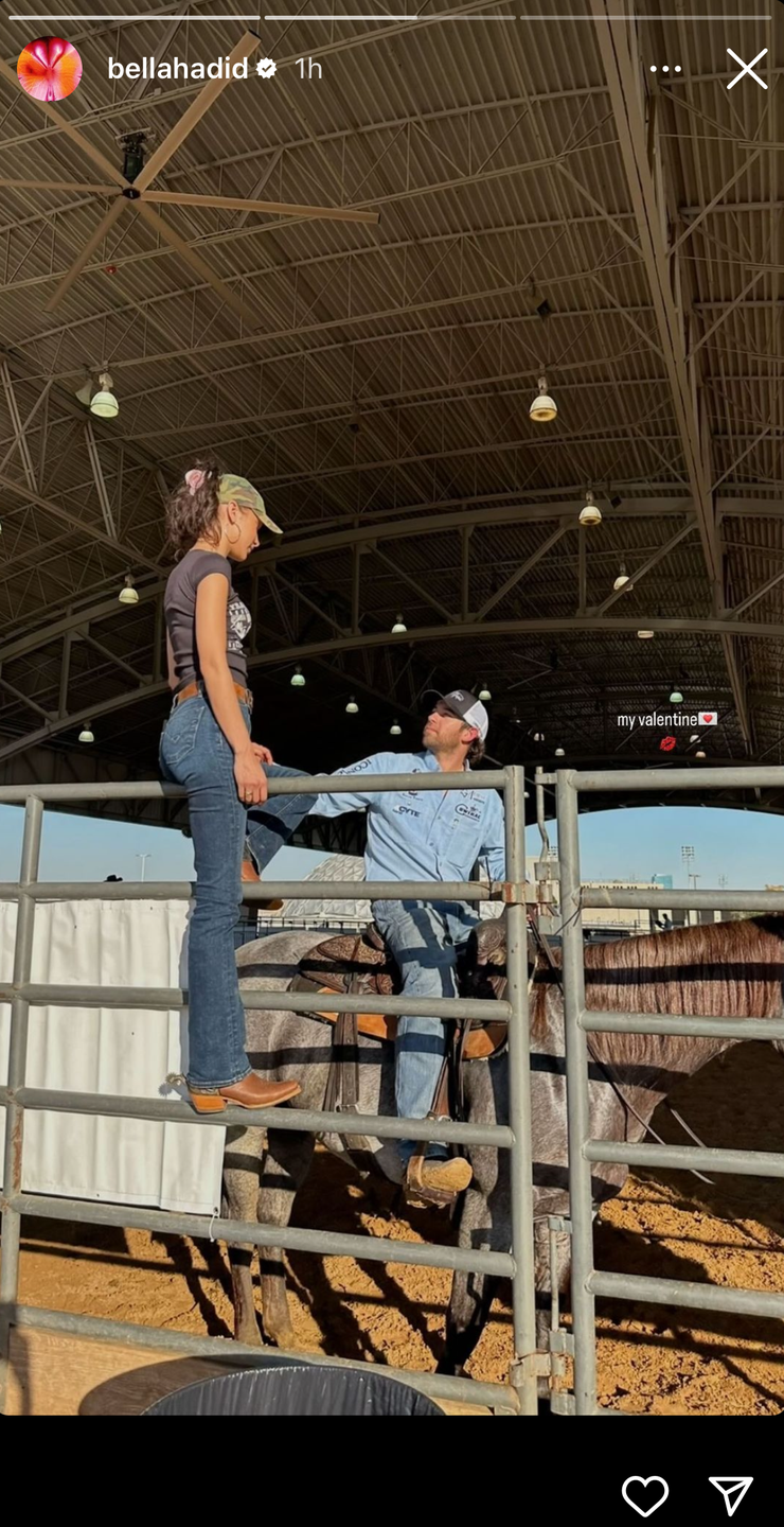 a man and a woman riding a horse in a barn