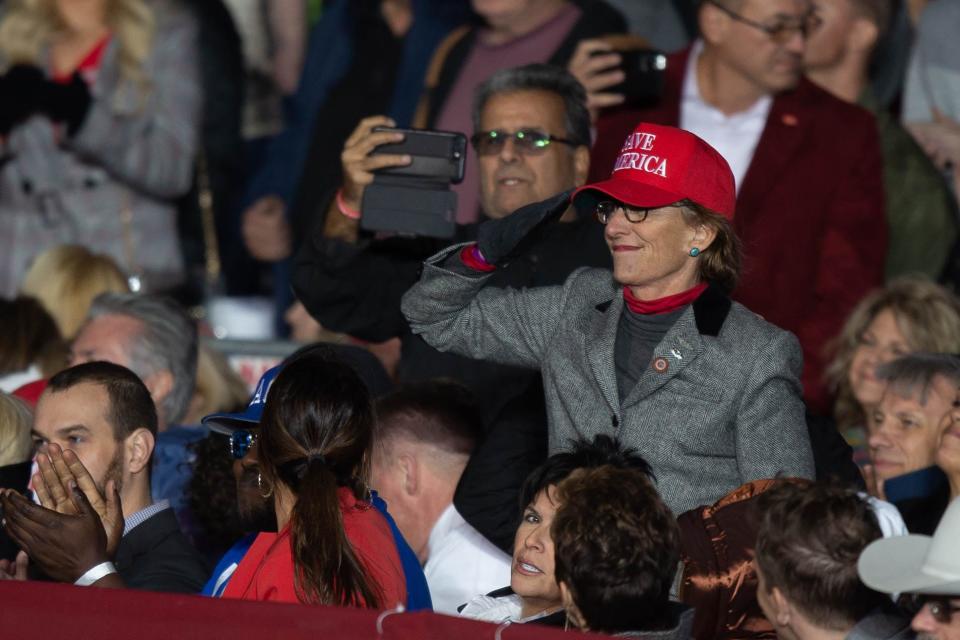 Arizona state Senator Wendy Rogers salutes former President Donald Trump at the Save America Rally in Florence on Jan. 15, 2022.