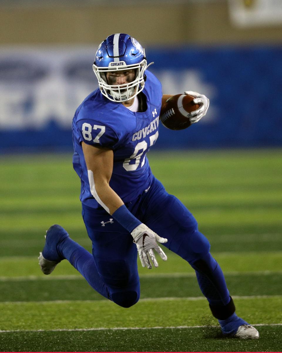 Covington Catholic tight end Michael Mayer runs the ball after a catch in the KHSAA 5A state championship final Dec. 7, 2019. Covington Catholic defeated Fredrick Douglass 14-7.