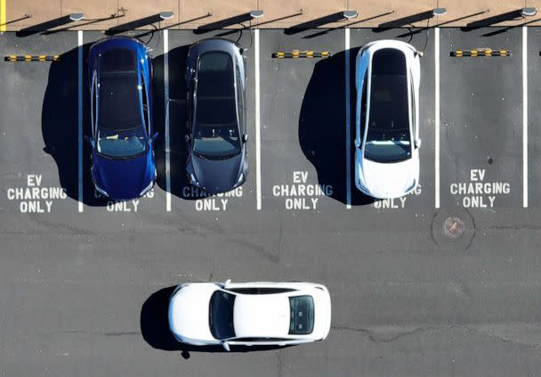 PHOTO: Tesla cars recharge at a Tesla charger station on Feb. 15, 2023 in Corte Madera, Calif. Tesla is partnering with the U.S. federal government to expand electric vehicle charging infrastructure in the U.S. (Justin Sullivan/Getty Images)