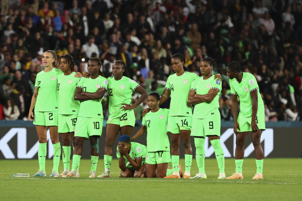 Nigeria's players hug during a penalty shootout during the Women's World Cup round of 16 soccer match between England and Nigeria in Brisbane, Australia, Monday, Aug. 7, 2023. (AP Photo/Tertius Pickard)
