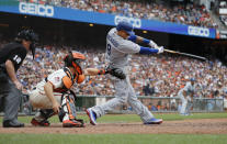 Los Angeles Dodgers' Manny Machado (8) hits a RBI triple for the go ahead run against the San Francisco Giants during the eighth inning of a baseball game in San Francisco, Saturday, Sept. 29, 2018. (AP Photo/Jim Gensheimer)