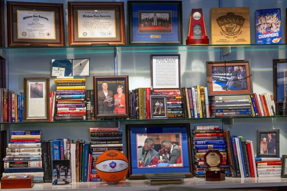 Looking to Bill Self’s right from his desk is memorabilia emphasizing his mentors and other coaching relationships.