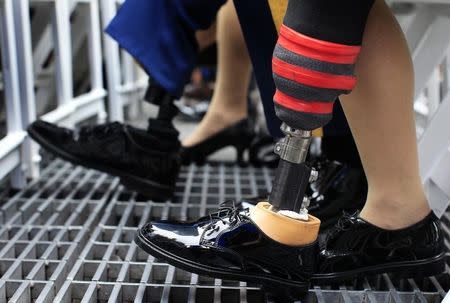 Prosthetic legs are seen on U.S. Army soldiers attending the Army's 237th anniversary celebrations at Times Square in New York June 14, 2012. REUTERS/Shannon Stapleton