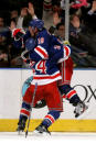 NEW YORK, NY - MAY 07: Brad Richards #19 of the New York Rangers celebrates with teammate Ryan Callahan #24 after scoring a goal to tie up the game late in the third period against Braden Holtby #70 of the Washington Capitals in Game Five of the Eastern Conference Semifinals during the 2012 NHL Stanley Cup Playoffs at Madison Square Garden on May 7, 2012 in New York City. (Photo by Bruce Bennett/Getty Images)