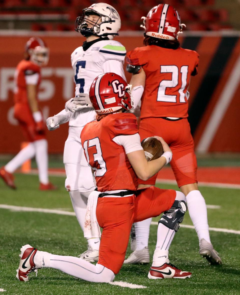 Crimson Cliffs’ Steele Barben takes a knee to run the clock down in the final minute of a 4A semifinal football game against Ridgeline at Rice-Eccles Stadium in Salt Lake City on Friday, Nov. 10, 2023. Crimson Cliffs won 31-24. | Kristin Murphy, Deseret News