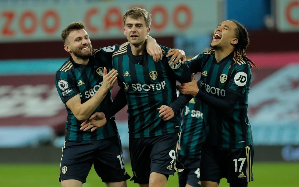 The Leeds striker is congratulated by his team-mates - TOM JENKINS