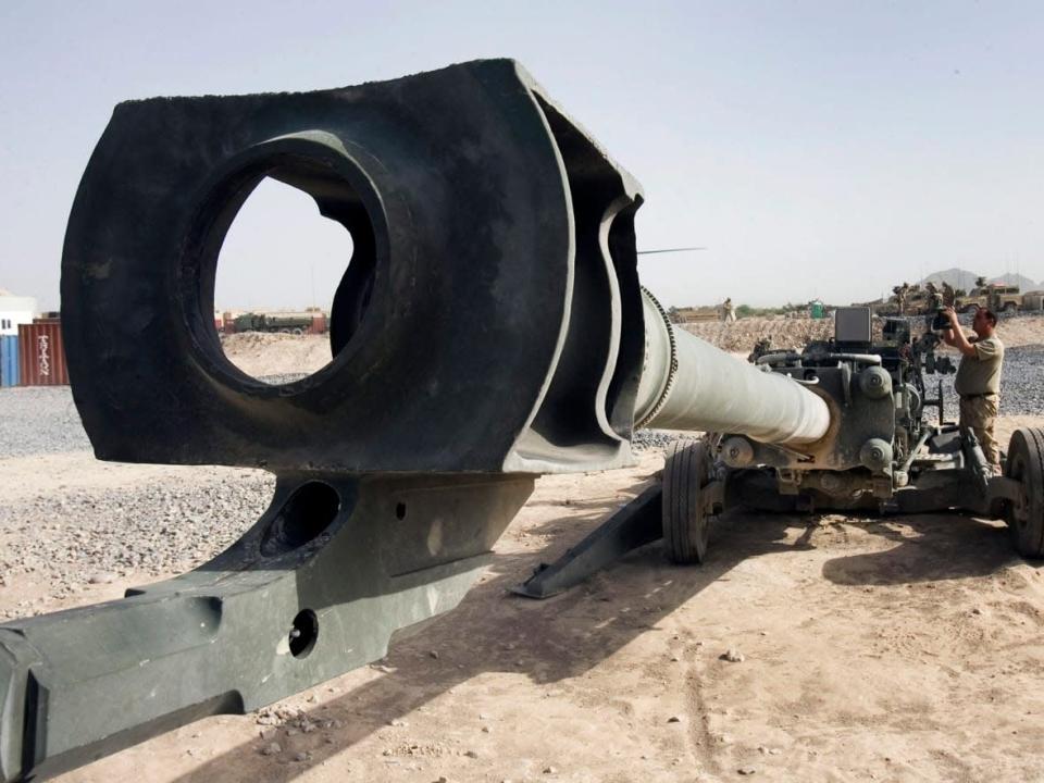 2nd Royal Canadian Horse Artillery Master Bombardier Art Fleming, from Chance Harbour, N.B., checks the sights on a M777 155mm howitzer at the forward operating base in Sperwingar, Afghanistan on April 22, 2007. (Ryan Remiorz/The Canadian Press - image credit)
