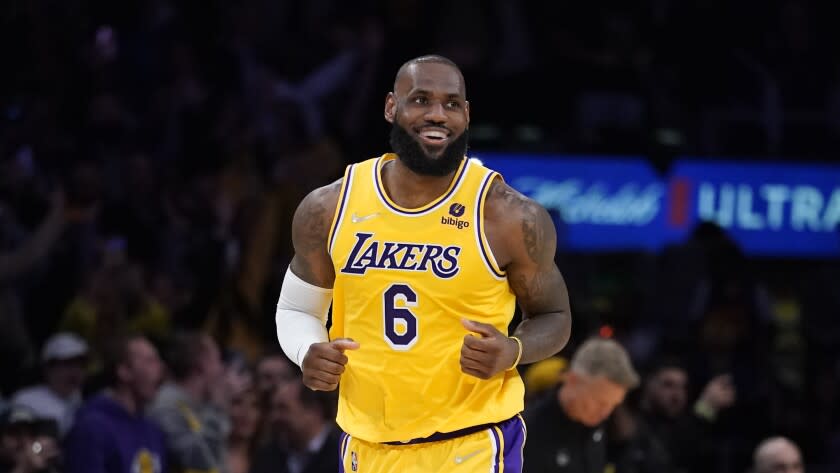 Los Angeles Lakers forward LeBron James (6) smiles during the first half of an NBA basketball game against the Golden State Warriors in Los Angeles, Saturday, March 5, 2022. (AP Photo/Ashley Landis)