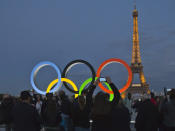 FILE - The Olympic rings are set up on Trocadero plaza that overlooks the Eiffel Tower, a day after the official announcement that the 2024 Summer Olympic Games will be in the French capital, in Paris, Thursday, Sept. 14, 2017. The organizers of the Paris Games say the Olympic rings will be displayed on the Eiffel Tower. The five-ring creation is 29-meters long and 15-meter high, made entirely of recycled steel, the Games organizers said in a statement Monday April, 8, 2024. (AP Photo//Michel Euler, File)