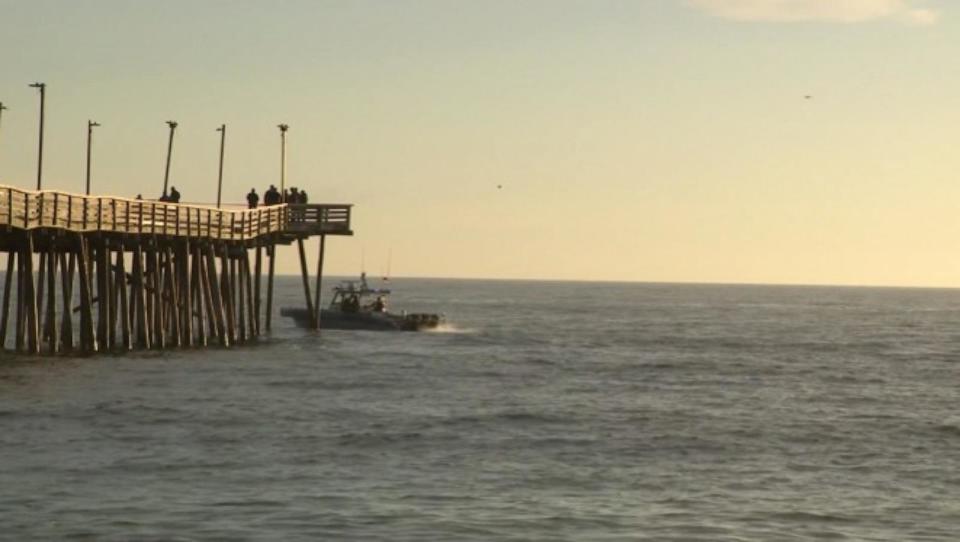 PHOTO: Law enforcement officials work at the scene where a car drove off the fishing pier in Virginia Beach, Virginia, on Jan. 27, 2024. (WVEC)