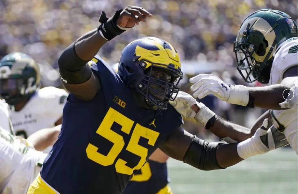 Michigan center Olusegun Oluwatimi plays against Colorado State during the second half of an NCAA football game, Saturday, Sept. 3, 2022, in Ann Arbor. Oluwatimi lost three friends and former teammates at Virginia in November 2022. Then four days later, his father had surgery to remove a brain tumor.