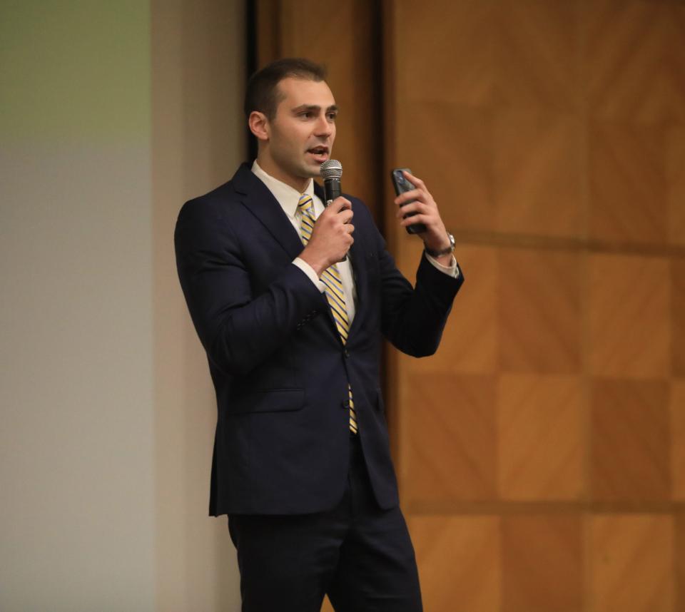 John Timm, a graduate from Spackenkill High School talks about his struggles with depression and mental health during an assembly at Our Lady of Lourdes High School on May 10, 2023. 