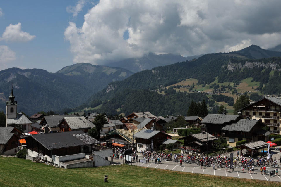 The pack of riders cycles during the 17th stage of the 110th edition of the Tour de France cycling race, 166 km between Saint-Gervais Mont-Blanc and Courchevel, in the French Alps, on July 19, 2023. (Photo by Thomas SAMSON / AFP)