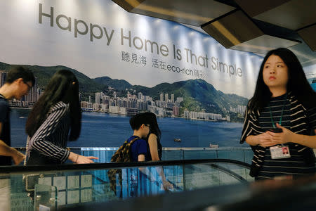 People visit a sales centre of LP6 property development by Nan Fung Group in Hong Kong, China August 26, 2018. Picture taken August 26, 2018. REUTERS/Bobby Yip