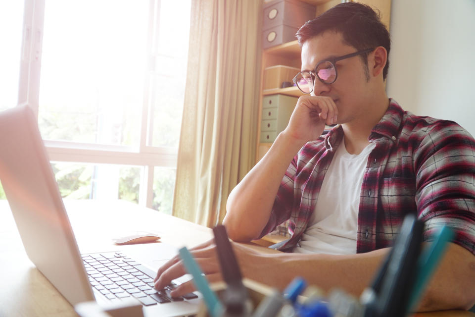 The Asian man working online.