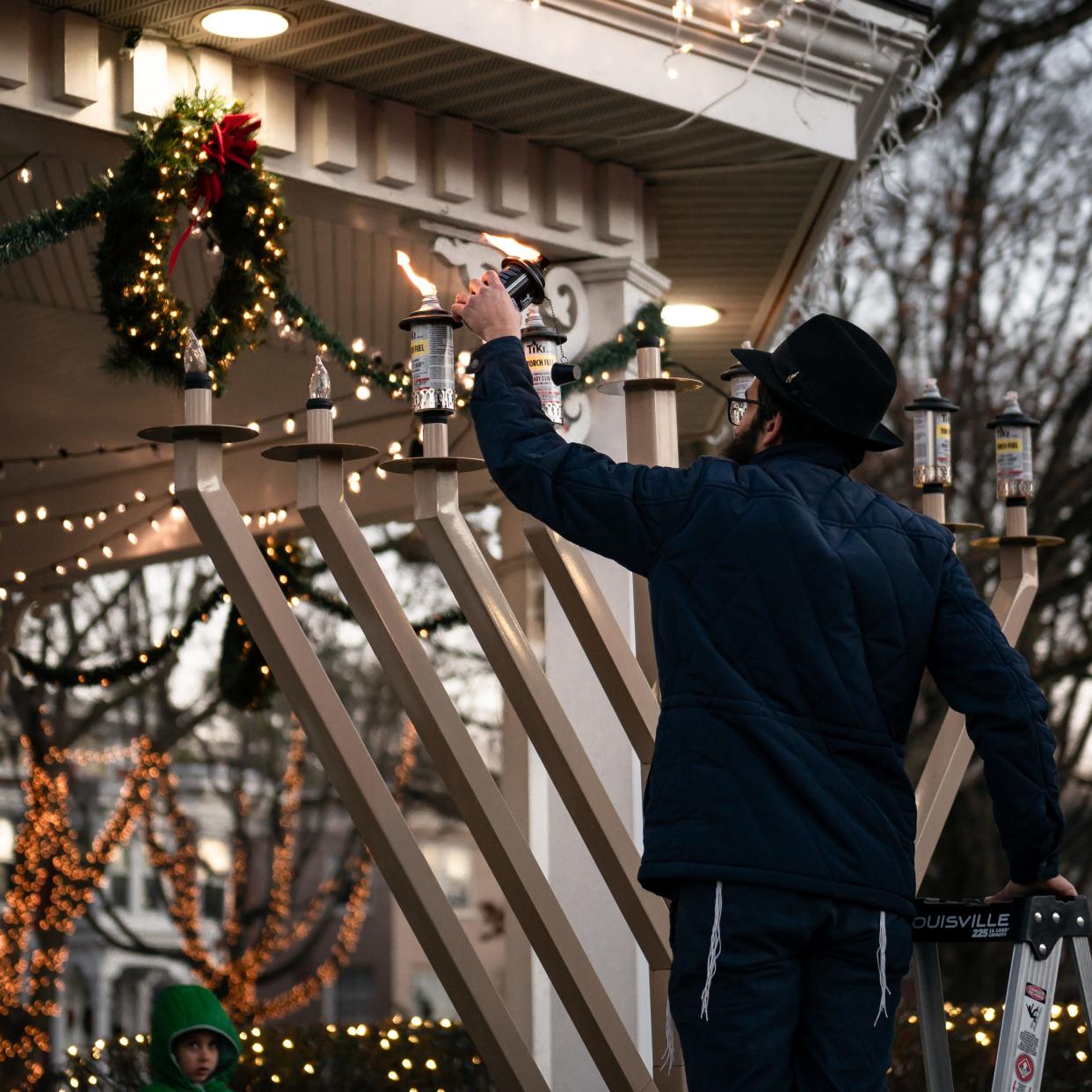 Rabbi Didy Waks from Chabad of Clinton lights the menorah in Clinton, NY on Tuesday, December 12, 2023.