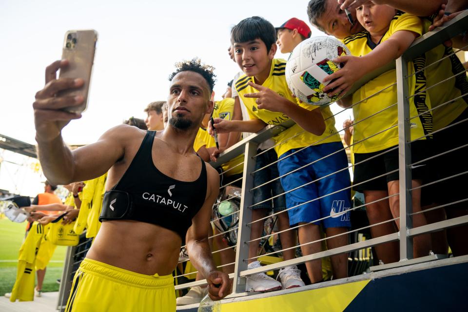 Nashville SC midfielder Hany Mukhtar (10) takes a photo with fans after their loss to Sporting Kansas City at Geodis Park in Nashville, Tenn., Sunday, June 19, 2022.