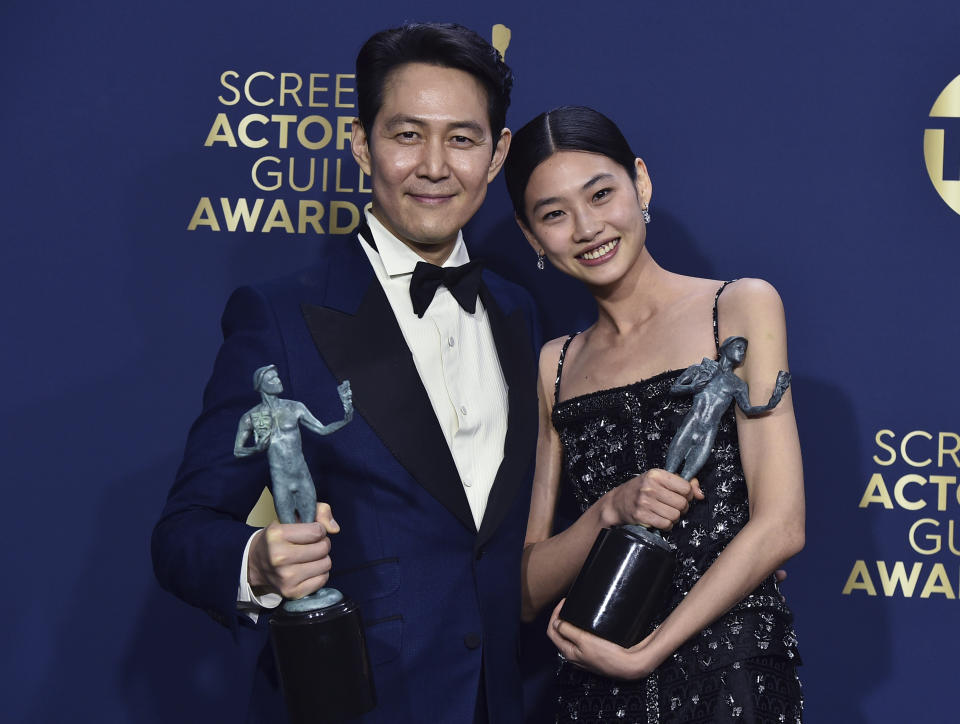 Lee Jung-Jae, winner of the award for outstanding performance by a male actor in a drama series for "Squid Game," left, and Jung Ho-yeon, winner of the award for outstanding performance by a female actor in a drama series for "Squid Game," pose in the press room at the 28th annual Screen Actors Guild Awards at the Barker Hangar on Sunday, Feb. 27, 2022, in Santa Monica, Calif. (Photo by Jordan Strauss/Invision/AP)