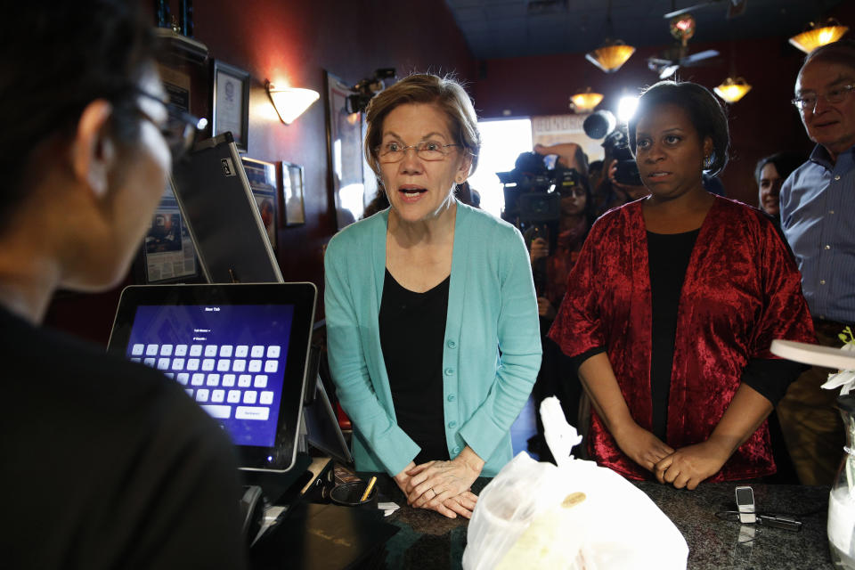 Democratic presidential candidate Sen. Elizabeth Warren, D-Mass., picks up food at EllaEm's Soul Food, Thursday, Feb. 20, 2020, in North Las Vegas, Nev. (AP Photo/John Locher)