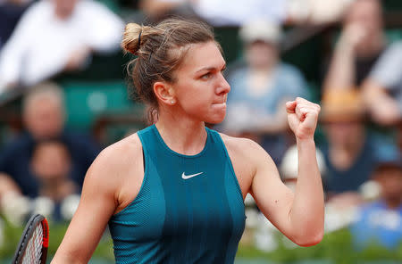 Tennis - French Open - Roland Garros, Paris, France - May 30, 2018 Romania's Simona Halep celebrates winning her first round match against Alison Riske of the U.S. REUTERS/Pascal Rossignol