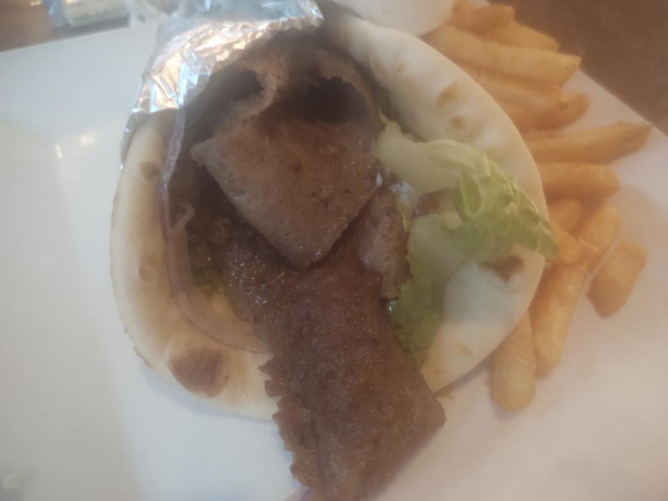 At Spiro's Taverna, the ‘famous’ gyro has a blend of beef and lamb cooked on a vertical rotisserie, sliced and then wrapped in a warm pita with tomatoes, red onions, lettuce and tzatziki (yogurt sauce).