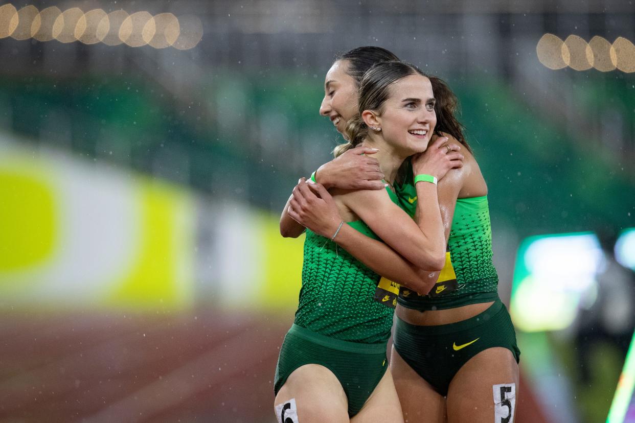 Oregon’s Maddy Elmore, left, and Dalia Frias embrace after finishing the 5,000 meters during the Oregon Twilight meet Friday, May 3, 2024, at Hayward Field in Eugene, Ore.