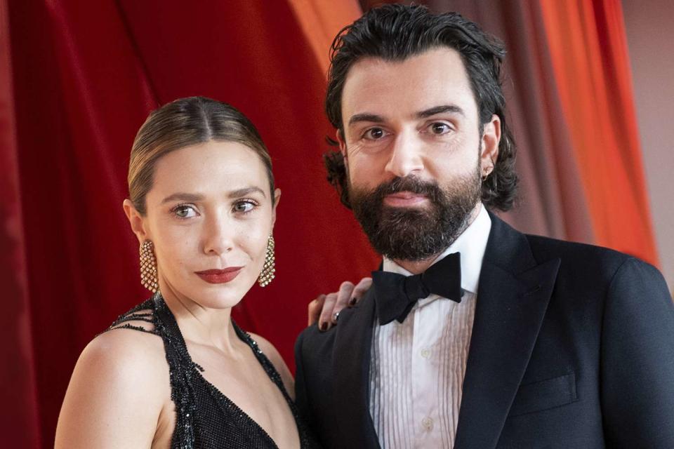 <p>Emma McIntyre/Getty</p> Elizabeth Olsen and Robbie Arnett at the 95th Annual Academy Awards.