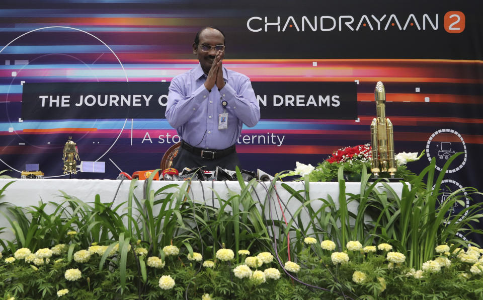 Indian Space Research Organization (ISRO) Chairman Kailasavadivoo Sivan greets journalists as he arrives for a press conference at their headquarters in Bangalore, India, Tuesday, Aug. 20, 2019. India has successfully launched a spacecraft into lunar orbit that aims to land on the far side of the moon and search for water. ISRO said Tuesday that it has maneuvered Chandrayaan, the Sanskrit word for “moon craft,” into lunar orbit. (AP Photo/Aijaz Rahi)