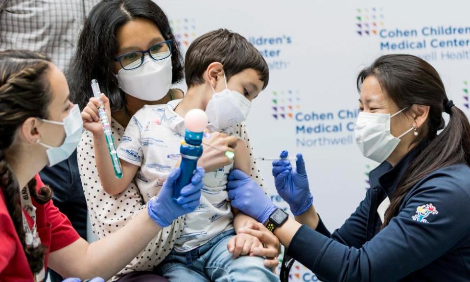 Dr Sophia Jan administers a coronavirus vaccination to Kevin Lazarus, four, at Long Island Jewish Medical Center in the Queens borough of New York this week.