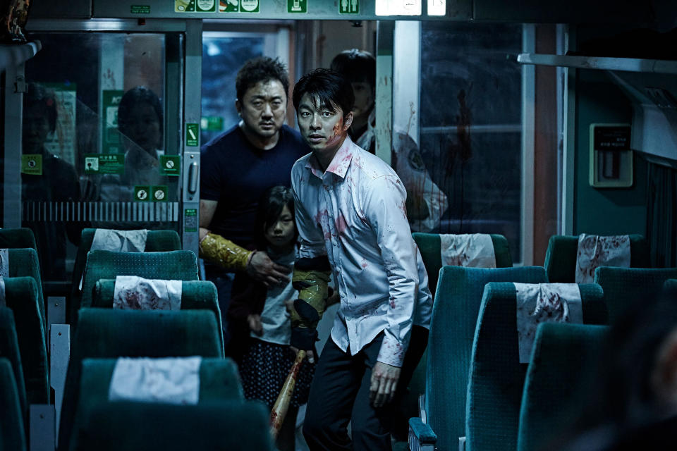 Ma Dong-Seok, Kim Soo-Ahn, and Gong Yoo make their way through a train