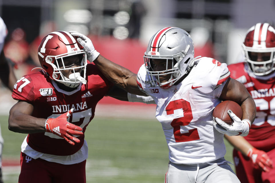 Ohio State running back J.K. Dobbins (2) runs past Indiana defensive back Devon Matthews (27) during the first half of an NCAA college football game, Saturday, Sept. 14, 2019, in Bloomington, Ind. (AP Photo/Darron Cummings)