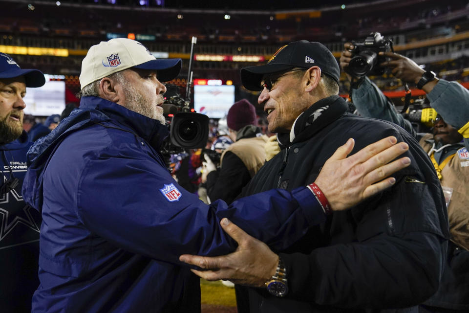 Dallas Cowboys head coach Mike McCarthy and Washington Commanders head coach Ron Rivera greet one another on the field at the end of an NFL football game, Sunday, Jan. 8, 2023, in Landover, Md. Washington won 26-6. (AP Photo/Patrick Semansky)