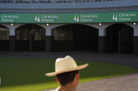 A man views the new $200 million paddock at Churchill Downs Wednesday, May 1, 2024, in Louisville, Ky. The 150th running of the Kentucky Derby is scheduled for Saturday, May 4. (AP Photo/Charlie Riedel)
