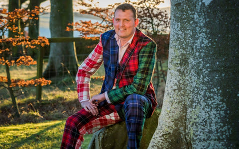 Doddie Weir in tartan suit - Credit: CHRIS WATT