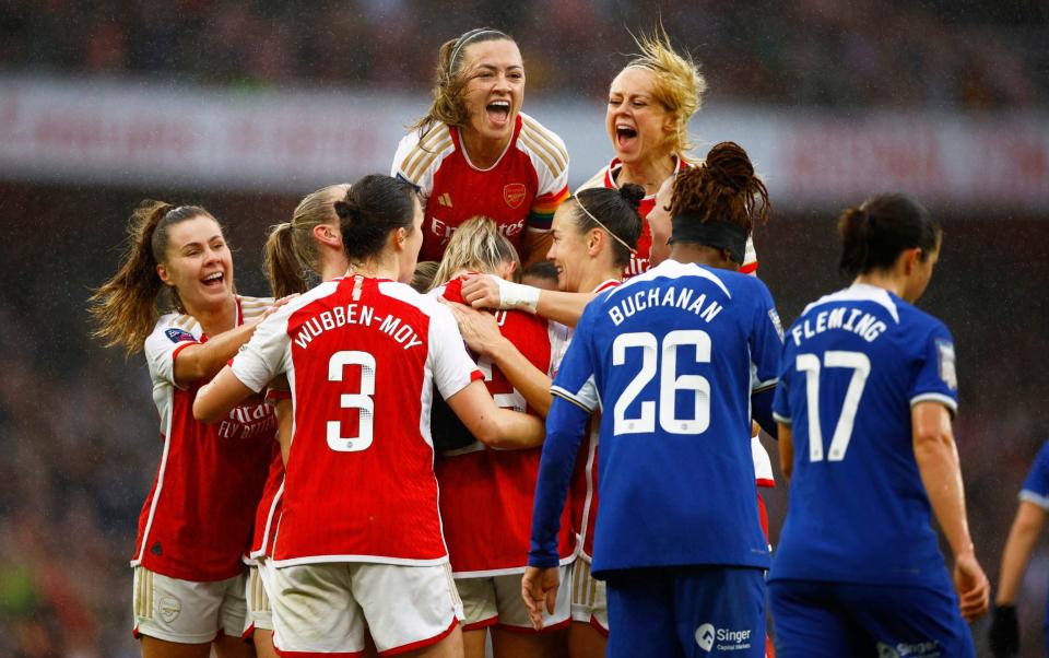 Arsenal celebrate their fourth goal scored by Alessia Russo