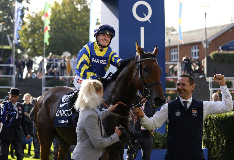 Jockey Hollie Doyle celebrates with horse Trueshan after winning the Qipco British Champions Long Distance Cup during the Qipco British Champions Day.