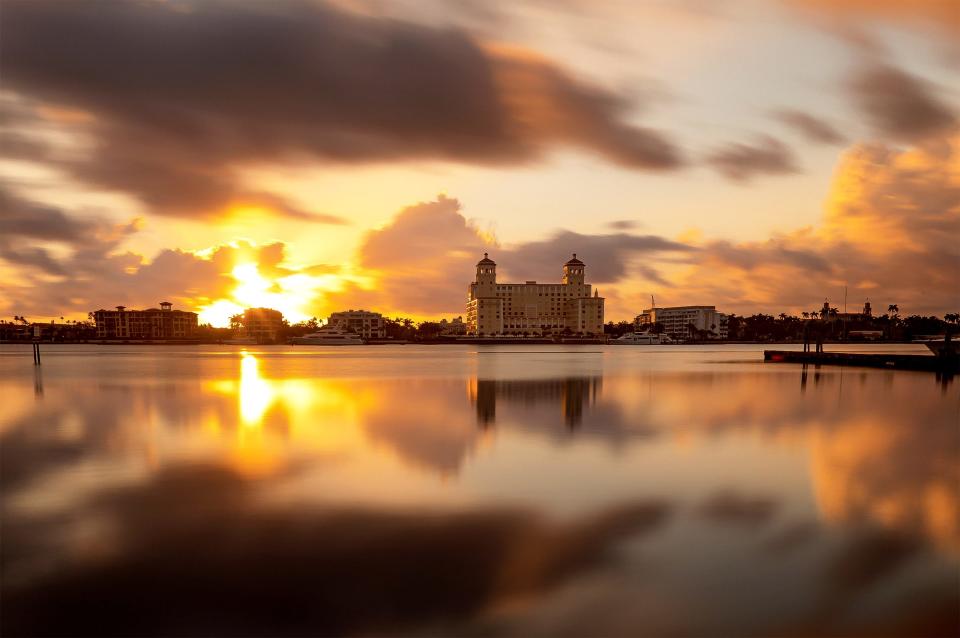 Built with twin towers on Lake Worth in the 1920s, the Palm Beach Biltmore condominium building, formerly the Biltmore Hotel, is seen at sunrise.