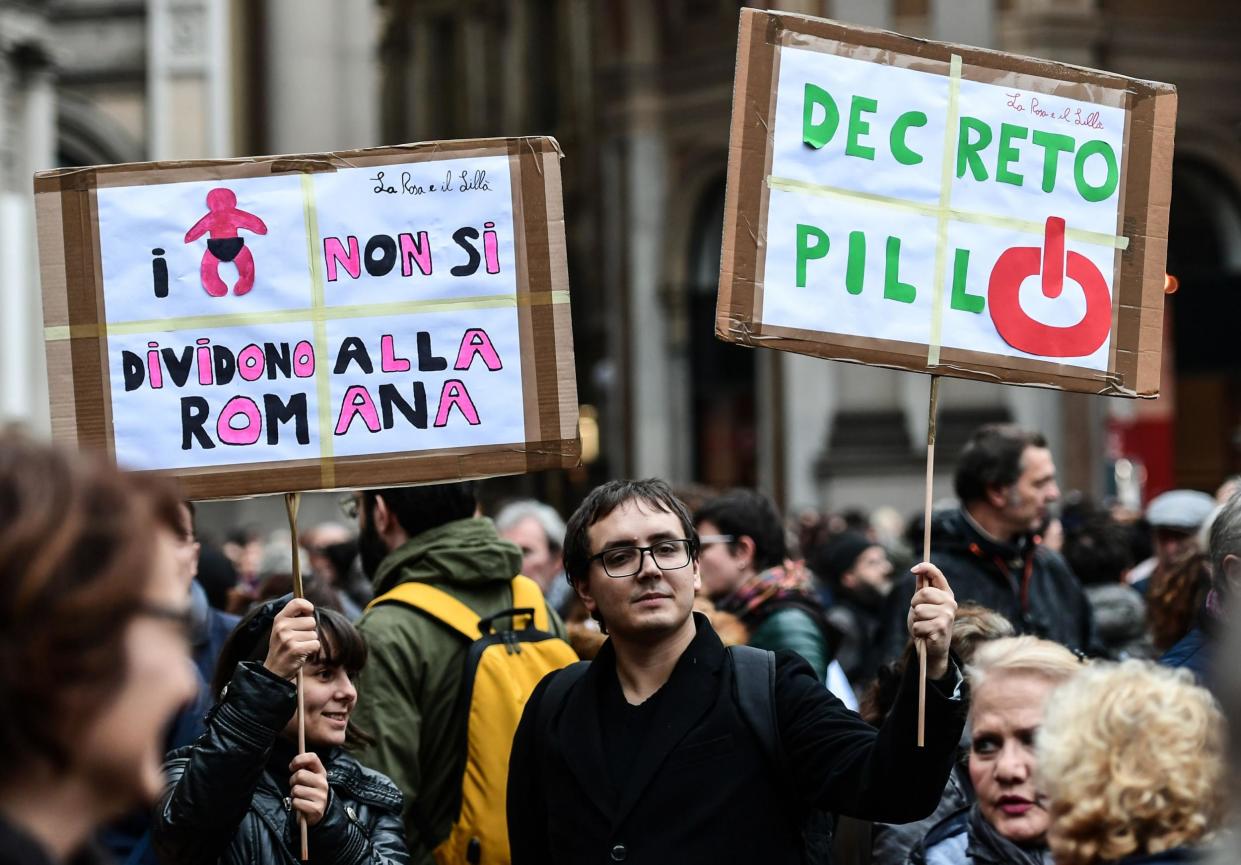 People gather on Piazza della Scala in Milan on 10 November 2018 to protest the so-called Pillon draft bill aimed at changing the rules on the separation of couples and the custody of children: Getty